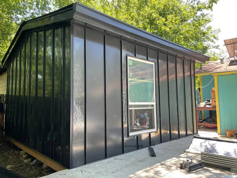 Black standing seam metal wall panels for Roof Inspection in McFarland