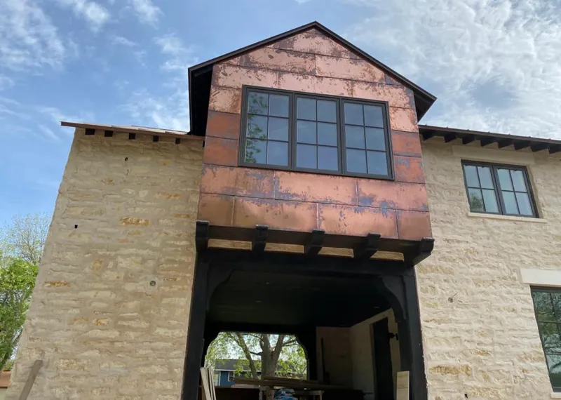 Copper metal panel facade on a stone building for Metal Roof Coating in McFarland
