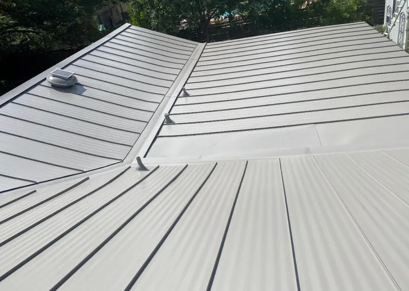 Solar attic fan installed on a metal roof for Roof Ventilation in McFarland